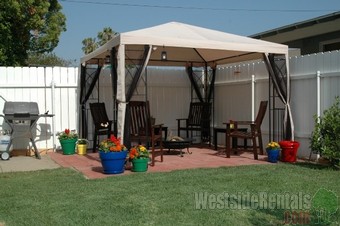 The back yard right off the kitchen door. Love the patio for our outdoor grilling and dining!